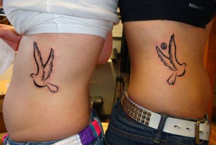 Tribal Dove Tattoo On Side Stomach